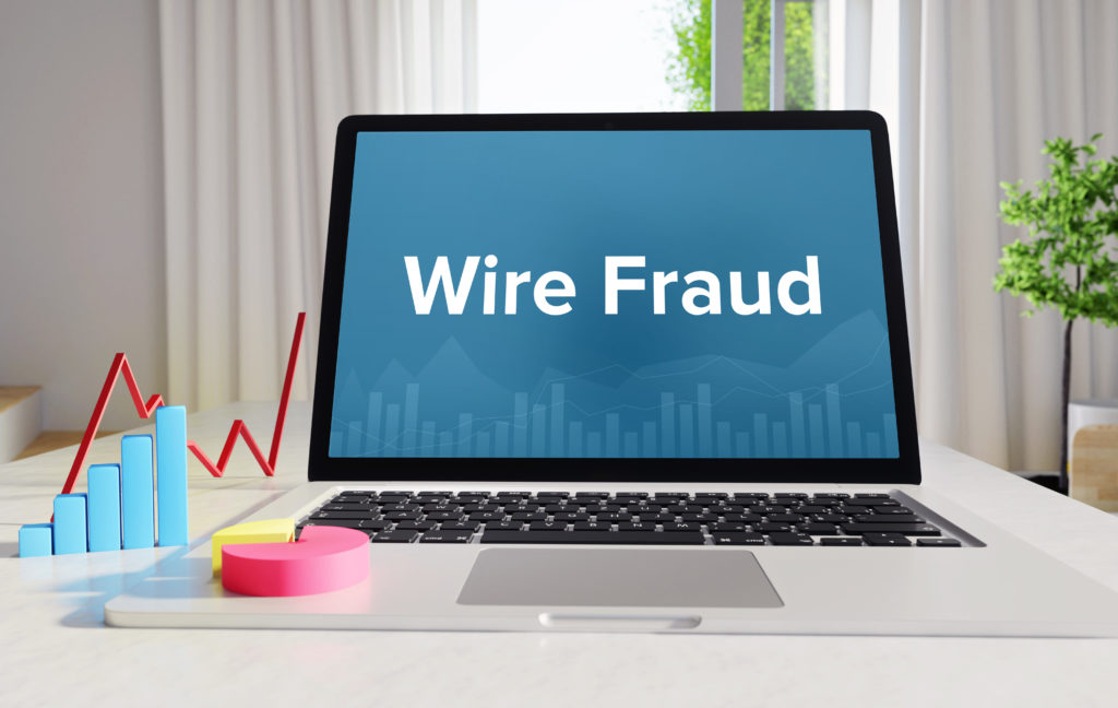 Wire Fraud – Statistics/Business. Laptop in the office with term on the display. Finance/Economics.